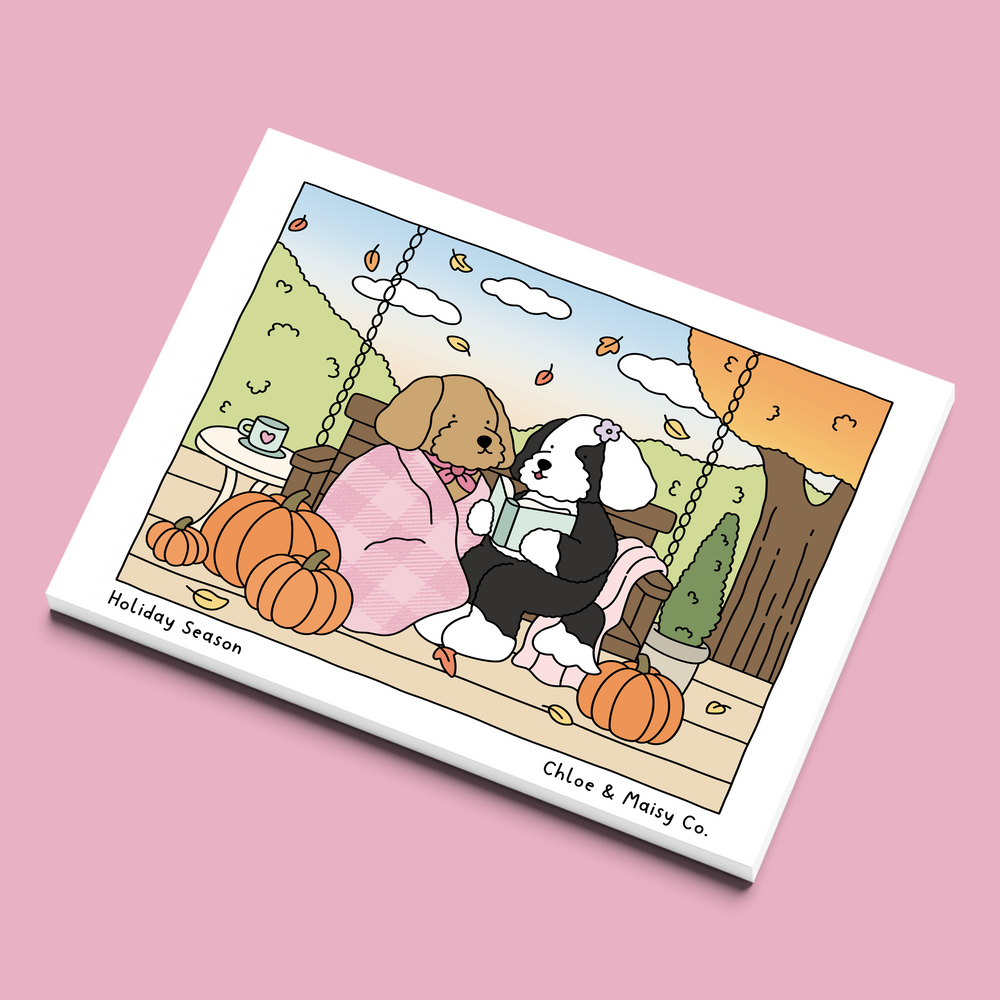 Cover of Holiday Season, a Chloe & Maisy adult coloring book of a sheepadoodle and a goldendoodle celebrating fall, Christmas and New Year's.